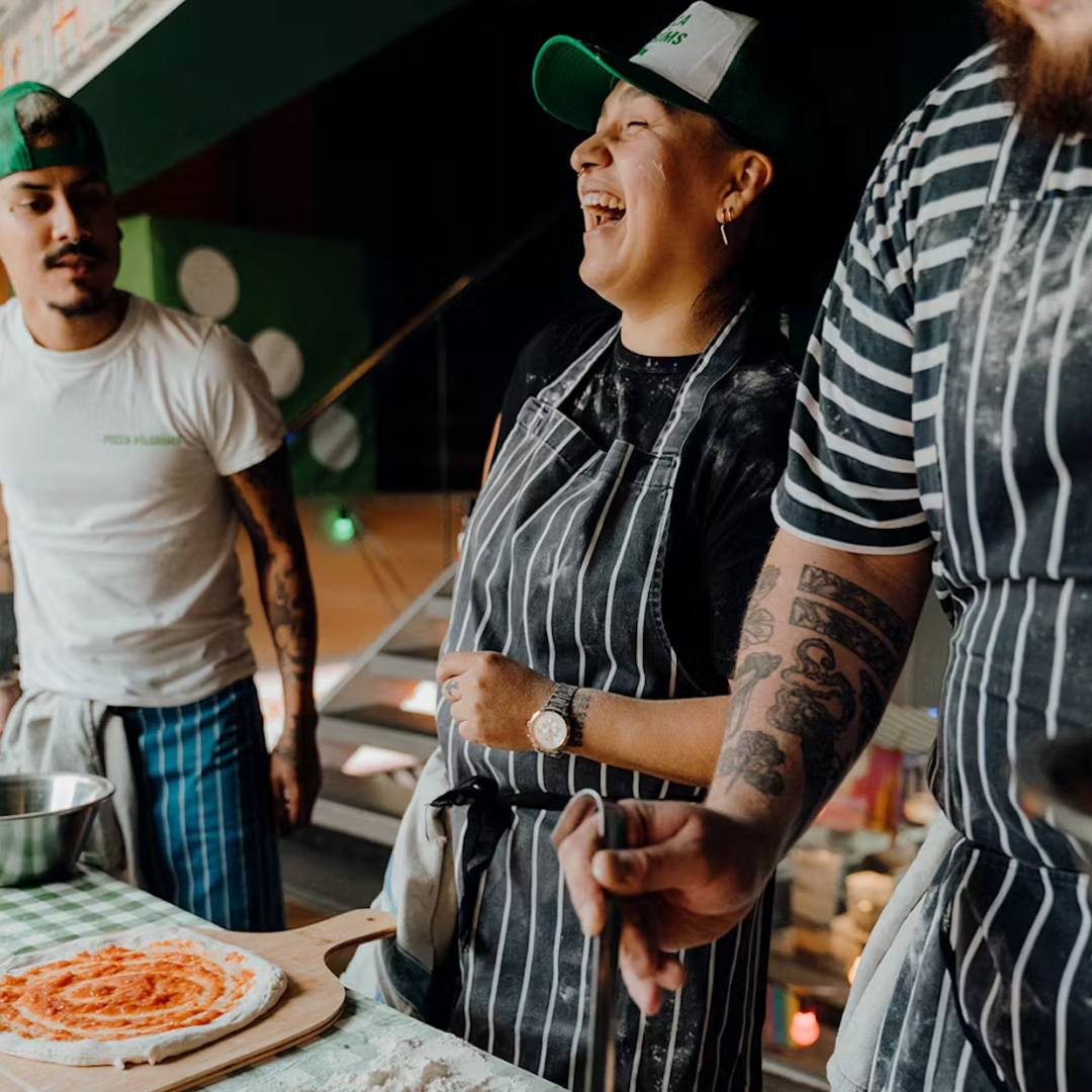 Singles participating in a pizza-making class in London
